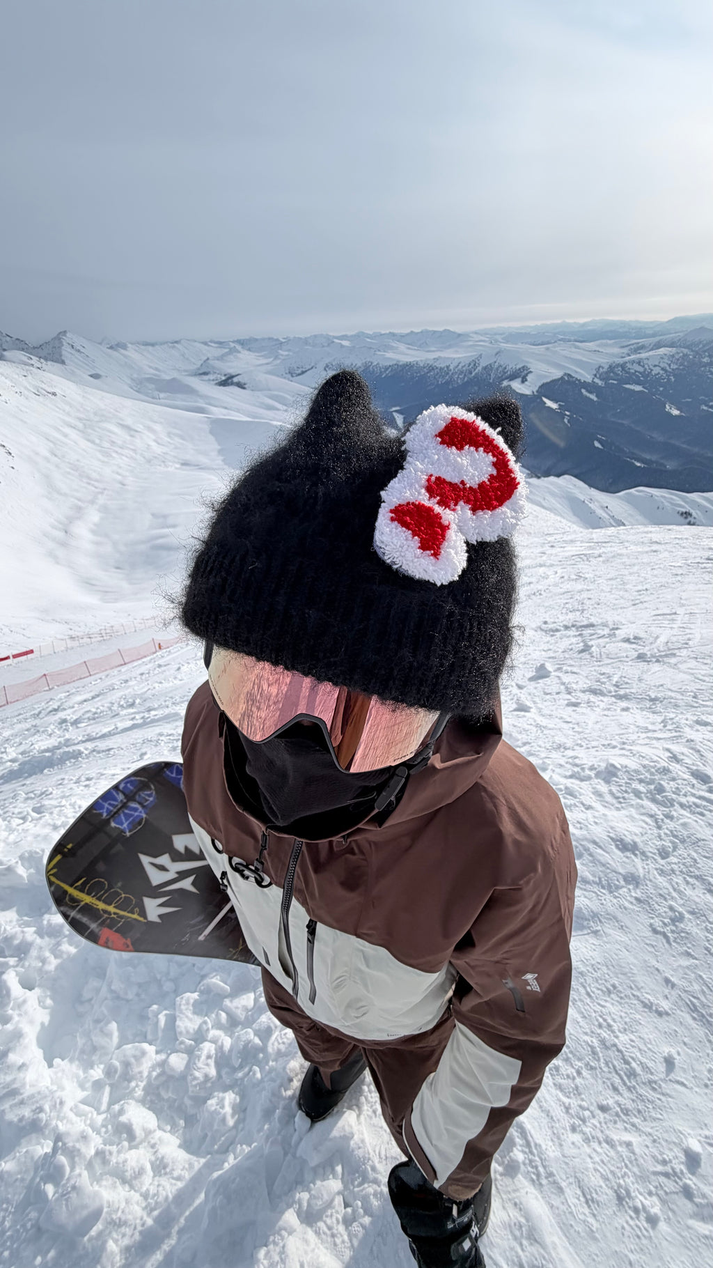 HB Snowear Cat-Ear Mohair Ski Beanie Black — worn on snowy mountain with snowboard