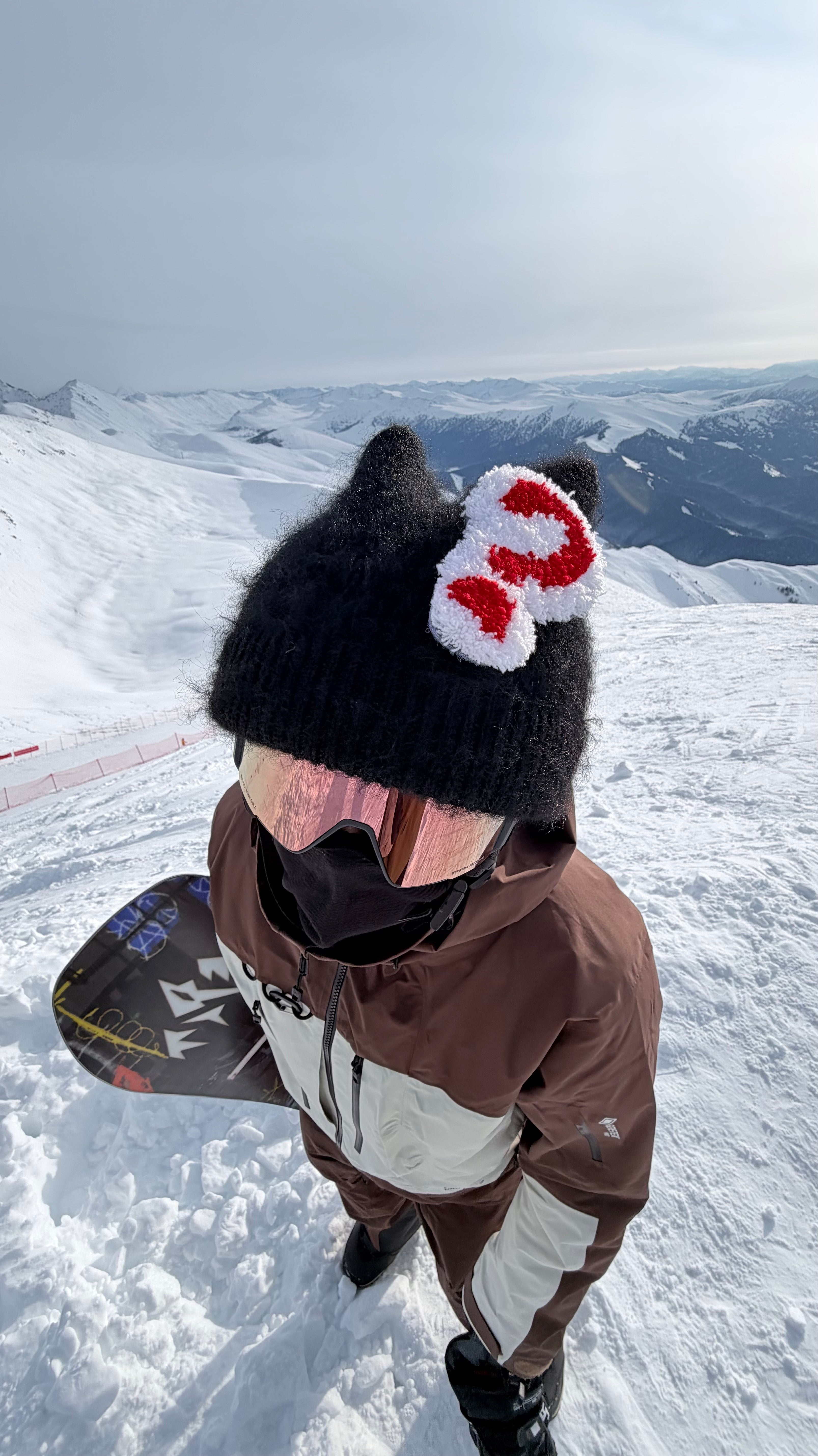 HB Snowear Cat-Ear Mohair Ski Beanie Black — worn on snowy mountain with snowboard